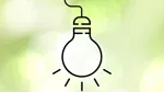 Illustrerad glödlampa mot diffus grön bakgrund.