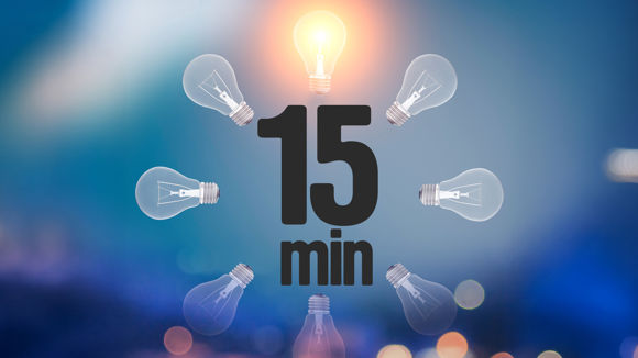 Texten "15 minuter" syns i en cirkel av glödlampor.